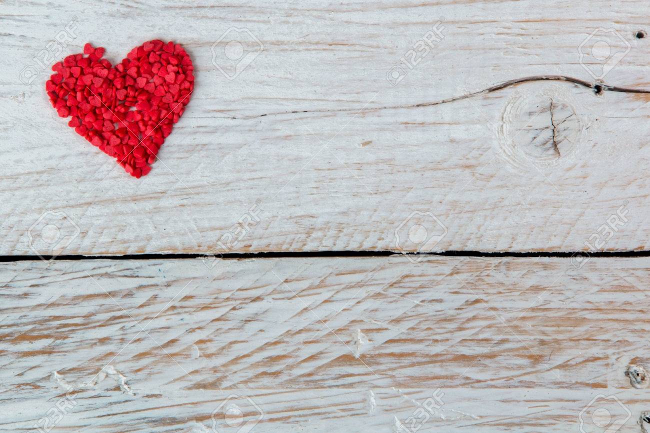 candy in the form of red hearts lie on the wood - 51975726 candy in the form of red hearts lie on the wood - 51975726