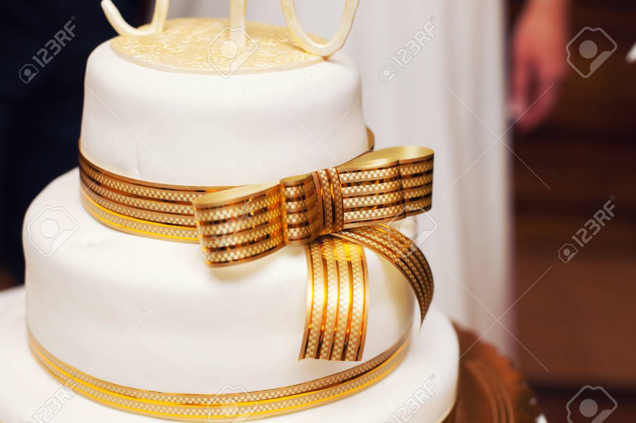 White Wedding Cake And Gold Tape Stock Photo Picture And Royalty Free Image Image