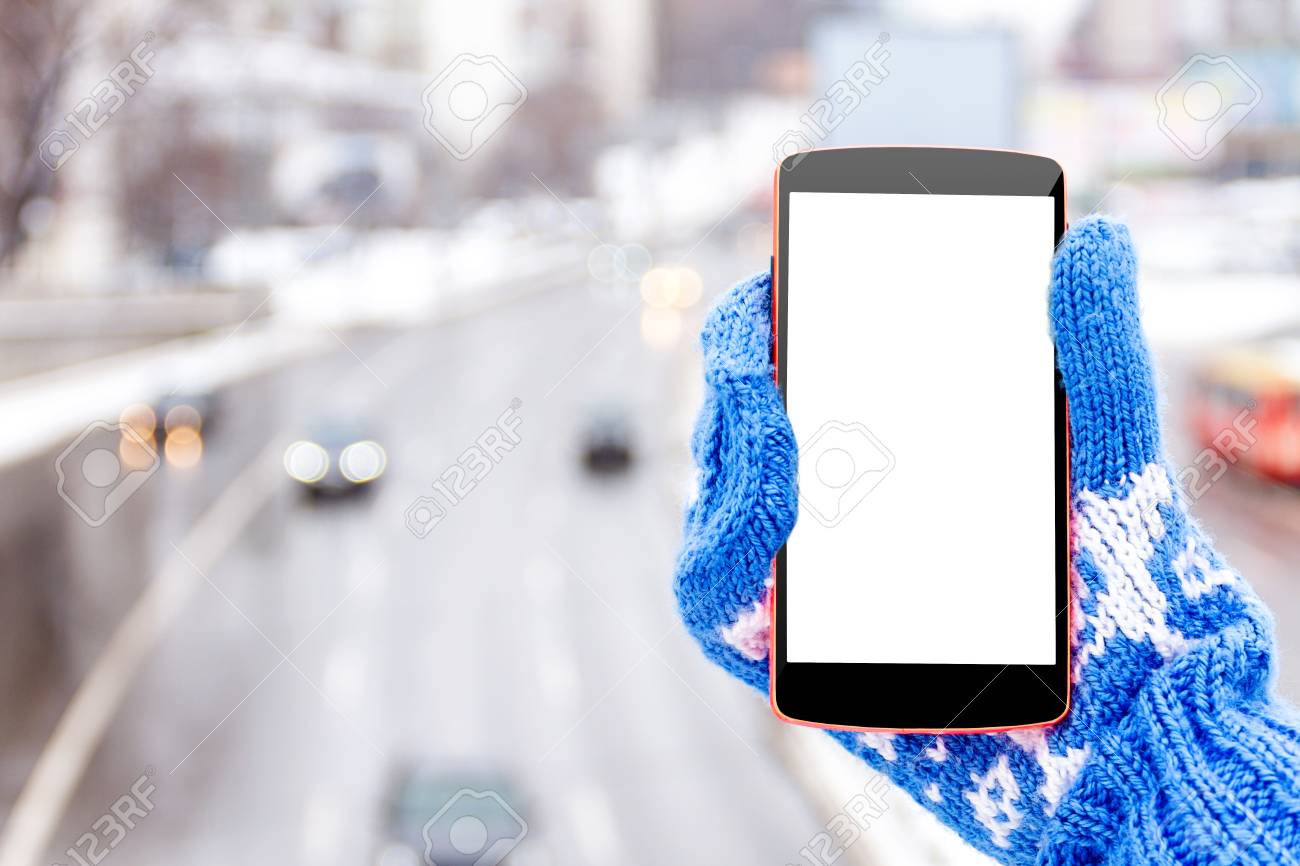 Female Woman Girl Hand In Blue Mittens With Mockup Smartphone In Winter In Urban Scene Stock Photo Picture And Royalty Free Image Image 89026734