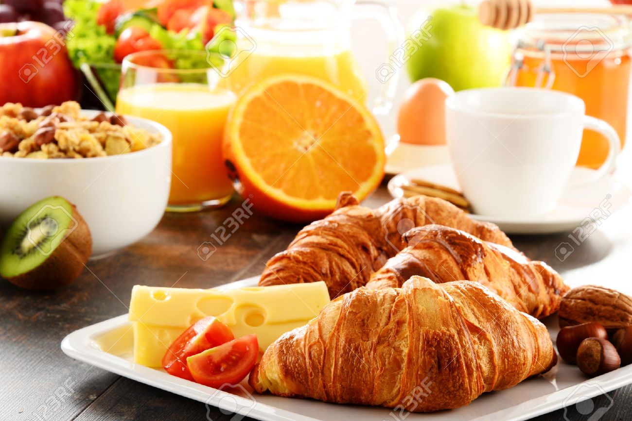Breakfast consisting of fruits, orange juice, coffee, honey, bread and egg. Balanced diet. - 40377225 Breakfast consisting of fruits, orange juice, coffee, honey, bread and egg. Balanced diet. - 40377225