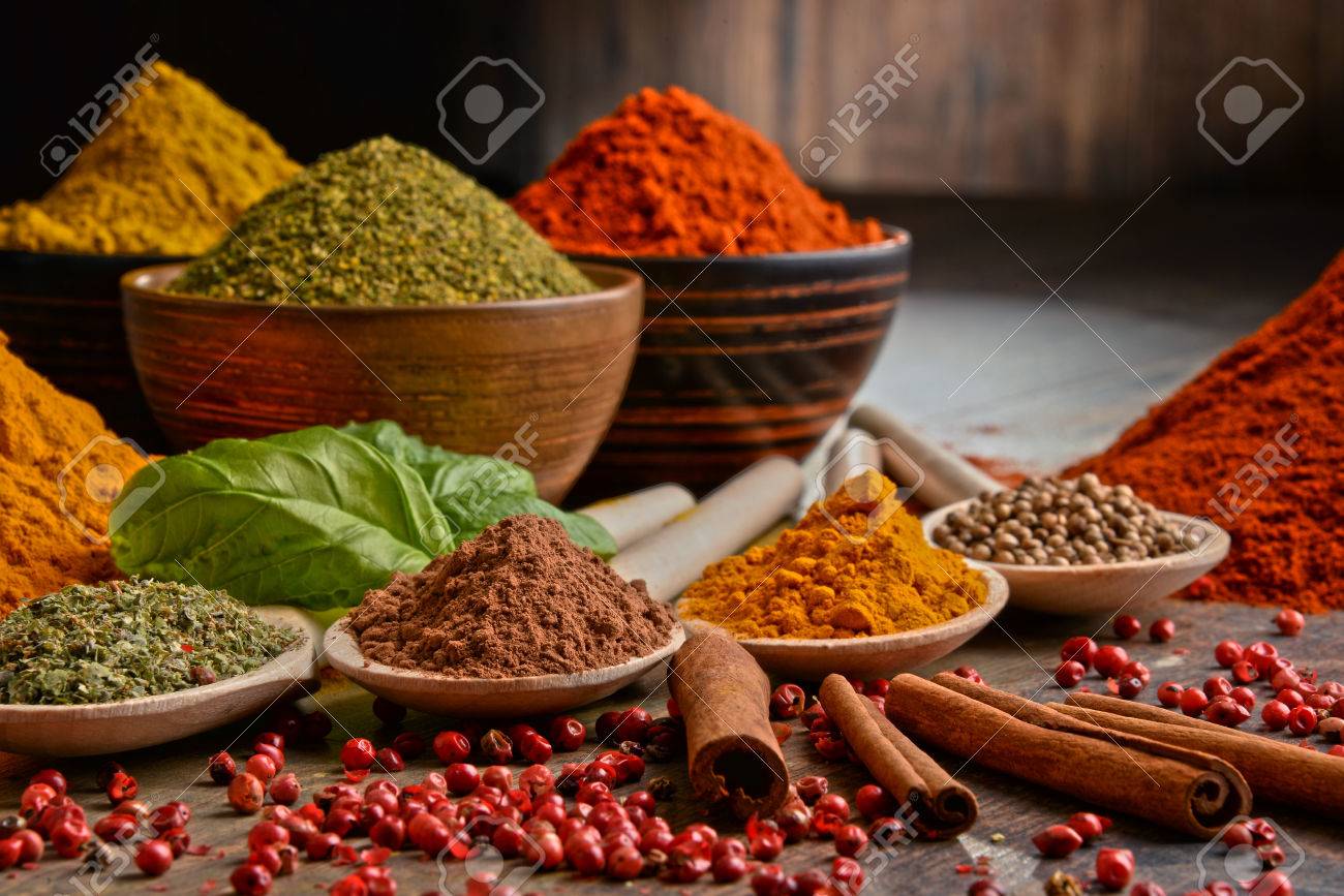 Variety of spices on kitchen table. - 52142548 Variety of spices on kitchen table. - 52142548
