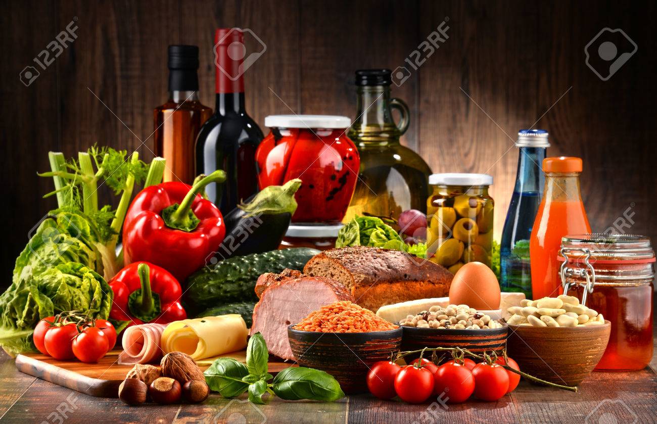 Composition with variety of organic food products on kitchen table - 61847354 Composition with variety of organic food products on kitchen table - 61847354