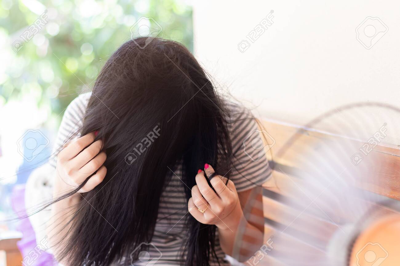 drying hair with fan