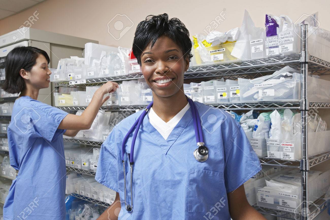 Portrait Of Female Doctor Nurse Standing By Shelves With Medical Stock Photo Picture And Royalty Free Image Image 3812391