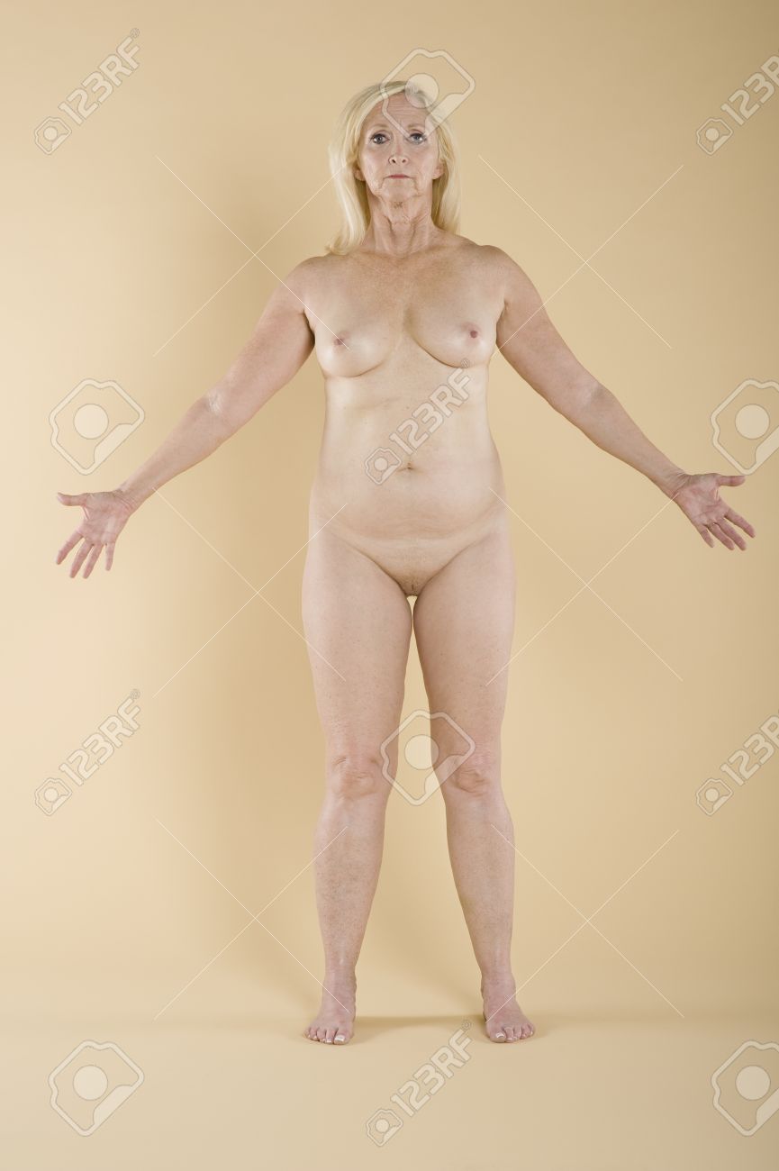 Full Length Of Naked Middle-aged Woman Standing With Arms Outstretched  Stock Photo, Picture and Royalty Free Image. Image 18779304.
