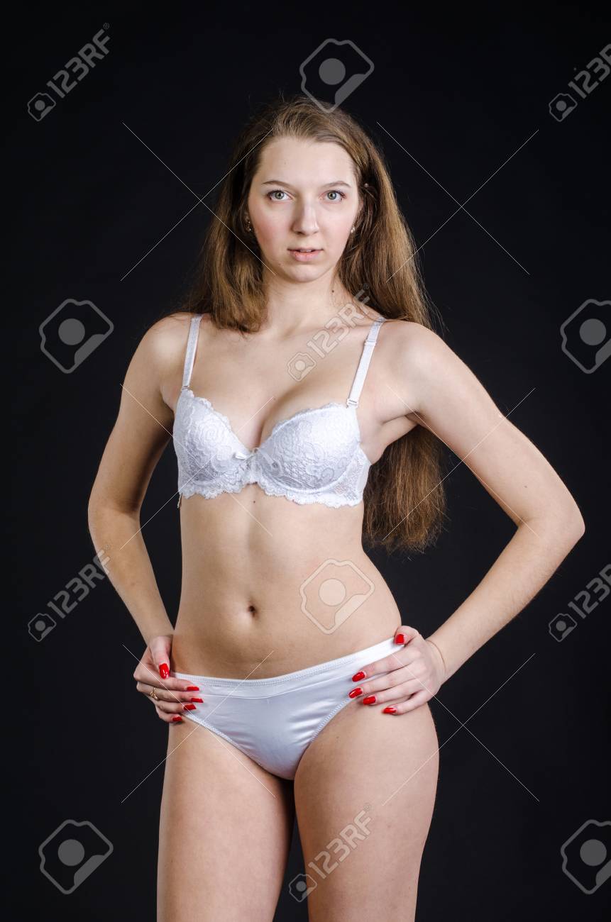 Young Sexy Girl In White Lingerie On A Black Background Stock Photo,  Picture and Royalty Free Image. Image 53746864.