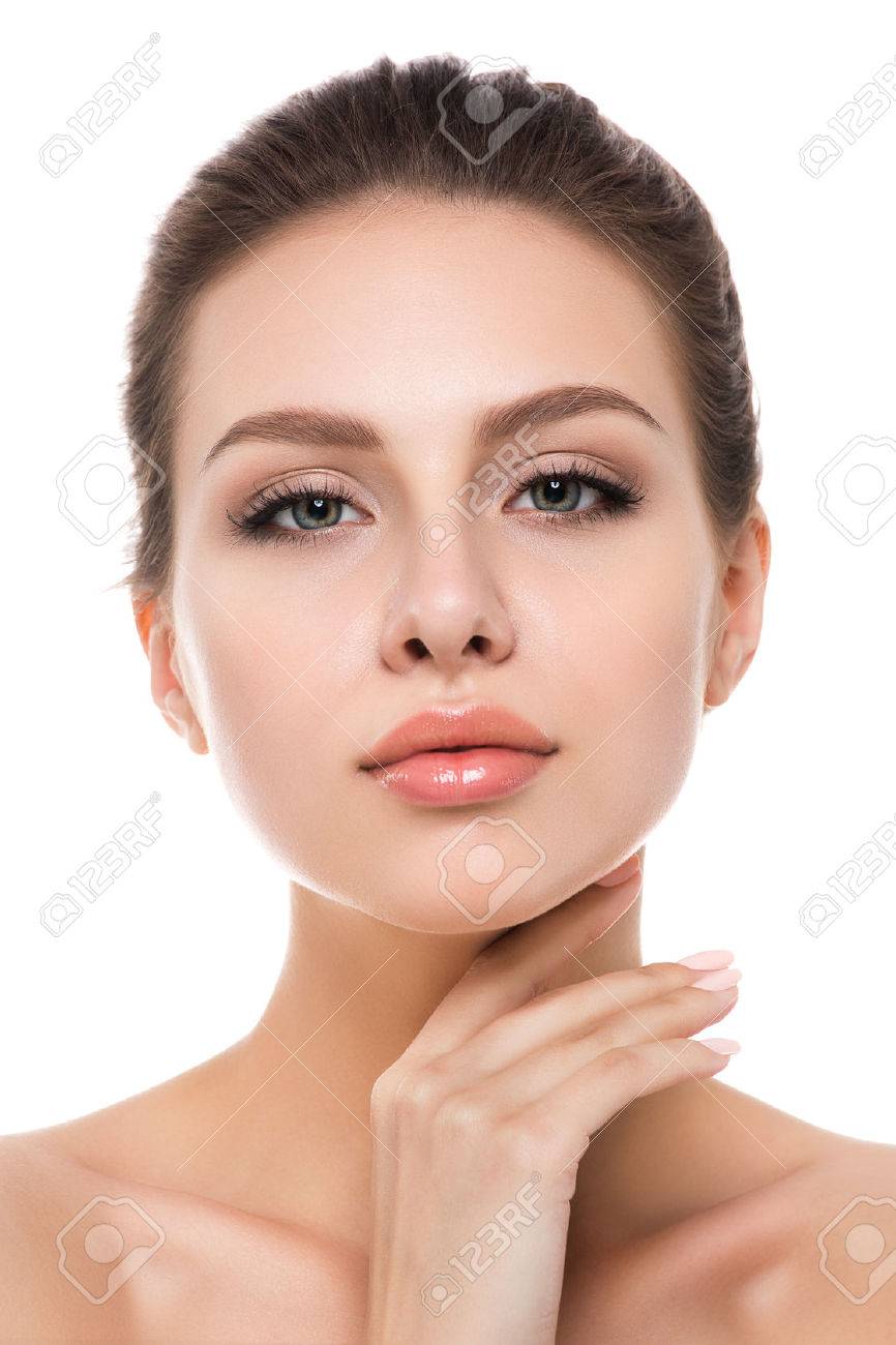 Portrait of young beautiful caucasian woman touching her face isolated over white background. Cleaning face, perfect skin. SPA therapy, skincare, cosmetology and plastic surgery concept - 60087367 Portrait of young beautiful caucasian woman touching her face isolated over white background. Cleaning face, perfect skin. SPA therapy, skincare, cosmetology and plastic surgery concept - 60087367