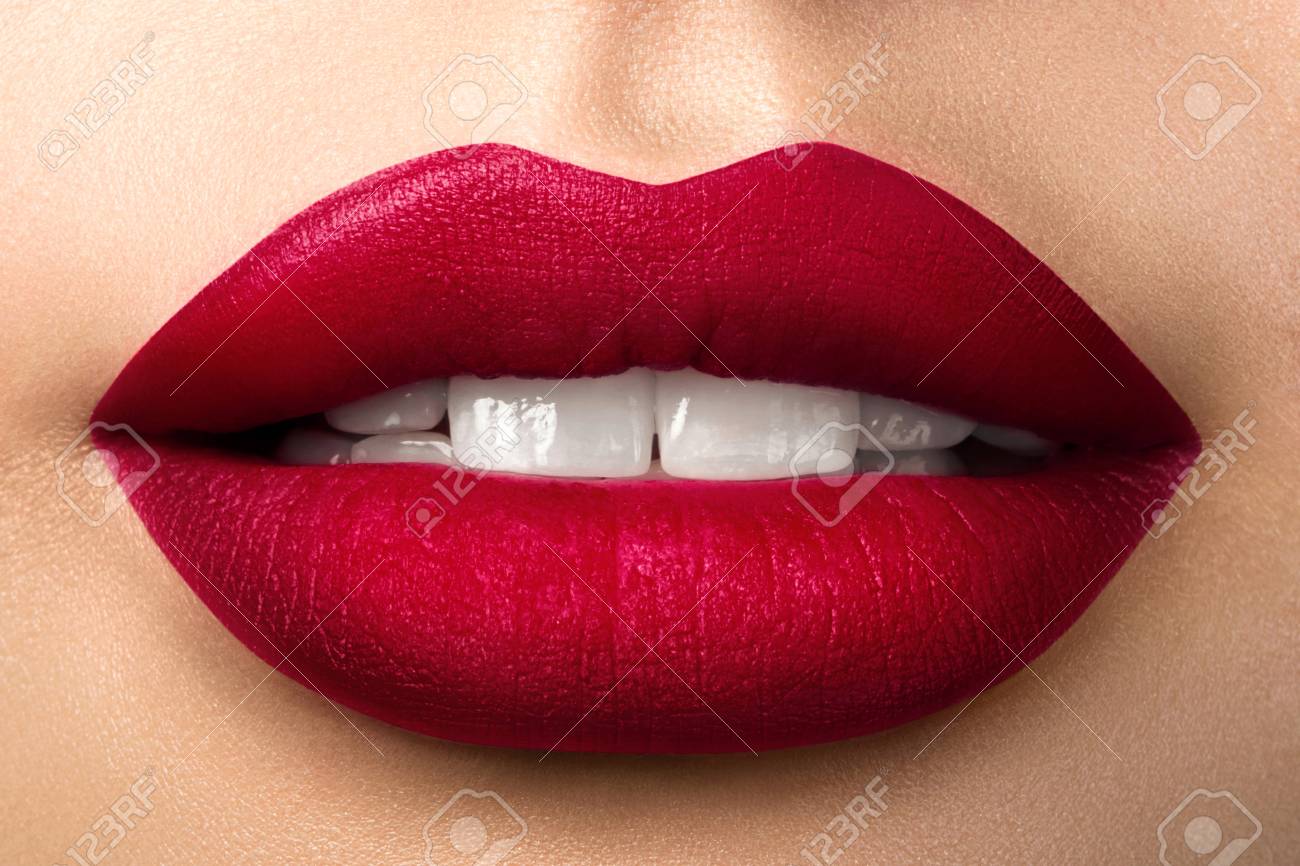 Close up view of beautiful woman lips with red matt lipstick. Open mouth with white teeth. Cosmetology, drugstore or fashion makeup concept. Beauty studio shot. Passionate kiss - 94965589 Close up view of beautiful woman lips with red matt lipstick. Open mouth with white teeth. Cosmetology, drugstore or fashion makeup concept. Beauty studio shot. Passionate kiss - 94965589