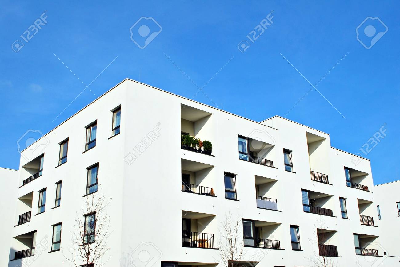 Modern Apartment Buildings On A Sunny Day With A Blue Sky ... Modern Apartment Buildings On A Sunny Day With A Blue Sky ...