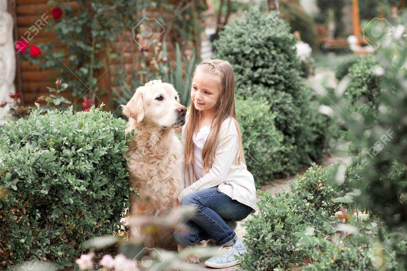 Cute Baby Girl 3 4 Year Old Holding Labrador Pet Outdoors