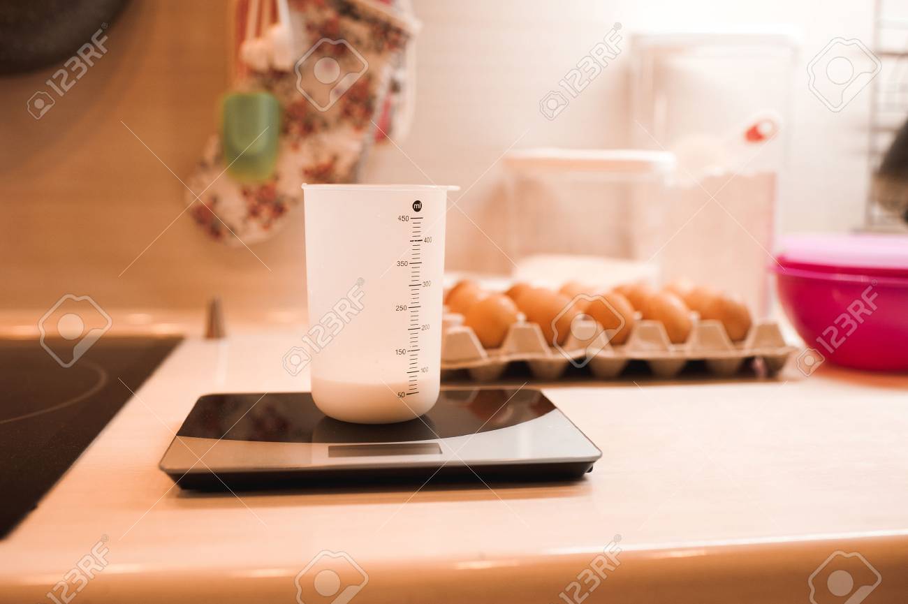 Cup Of Milk Staying On Scales Kitchen Table Closeup Stock Photo 66543737 Cup Of Milk Staying On Scales Kitchen Table Closeup Stock Photo 66543737