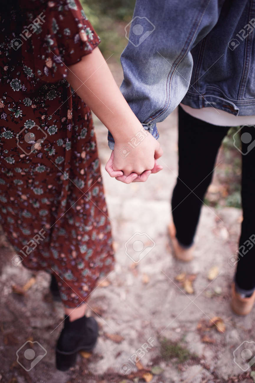 Teenage Girl And Boy Holding Hands Closeup Stock Photo, Picture and Royalty  Free Image. Image 151408097., image size:865x1300