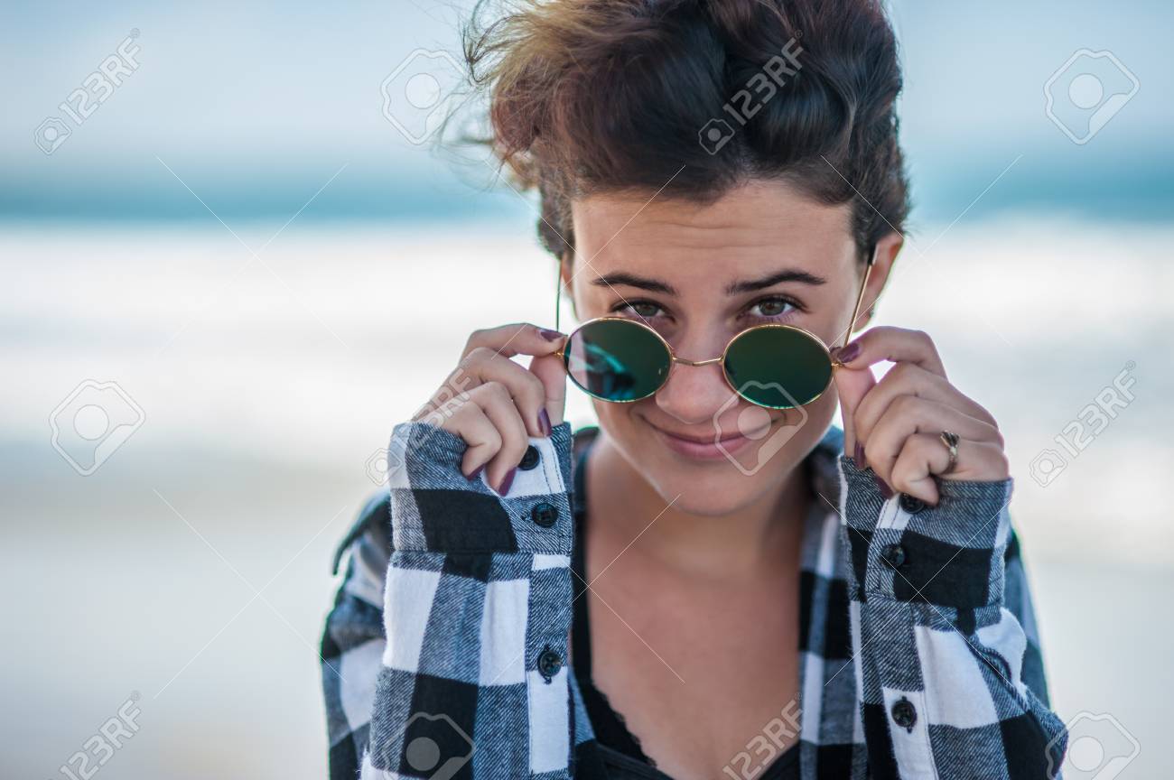 Happy Teen Head Shot At Beach With Female Looking Over Sunglasses Stock Photo Picture And Royalty Free Image Image Happy Teen Head Shot At Beach With Female Looking Over Sunglasses Stock Photo Picture And Royalty Free Image Image
