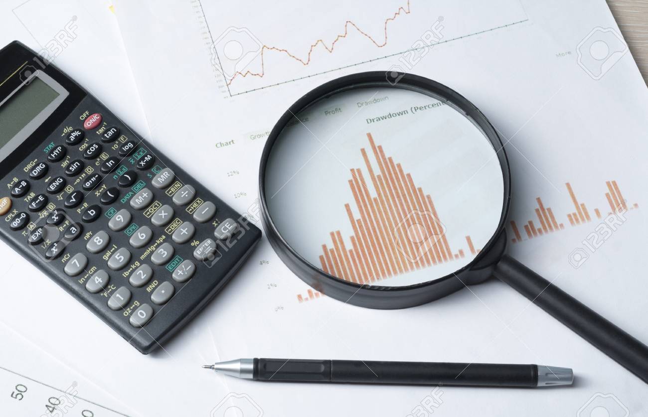 home savings budget concept chart pen calculator and magnifying