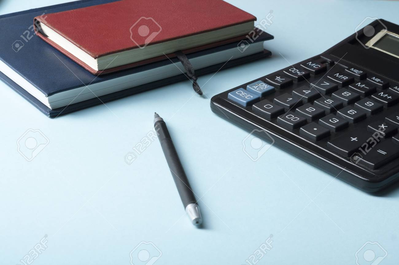 home savings budget concept calculator pen and accounting books