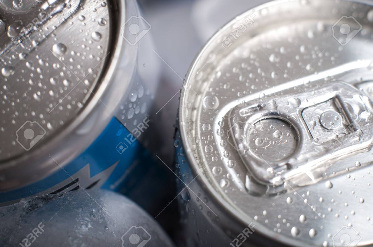 Top Of Aluminum Cans Of Soda Pop Covered In Ice And Droplets Stock