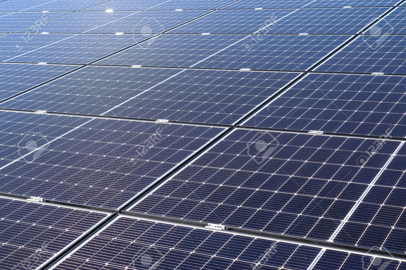 Generating clean energy with solar modules in a big park in northern Europe. - 169911713 Generating clean energy with solar modules in a big park in northern Europe. - 169911713