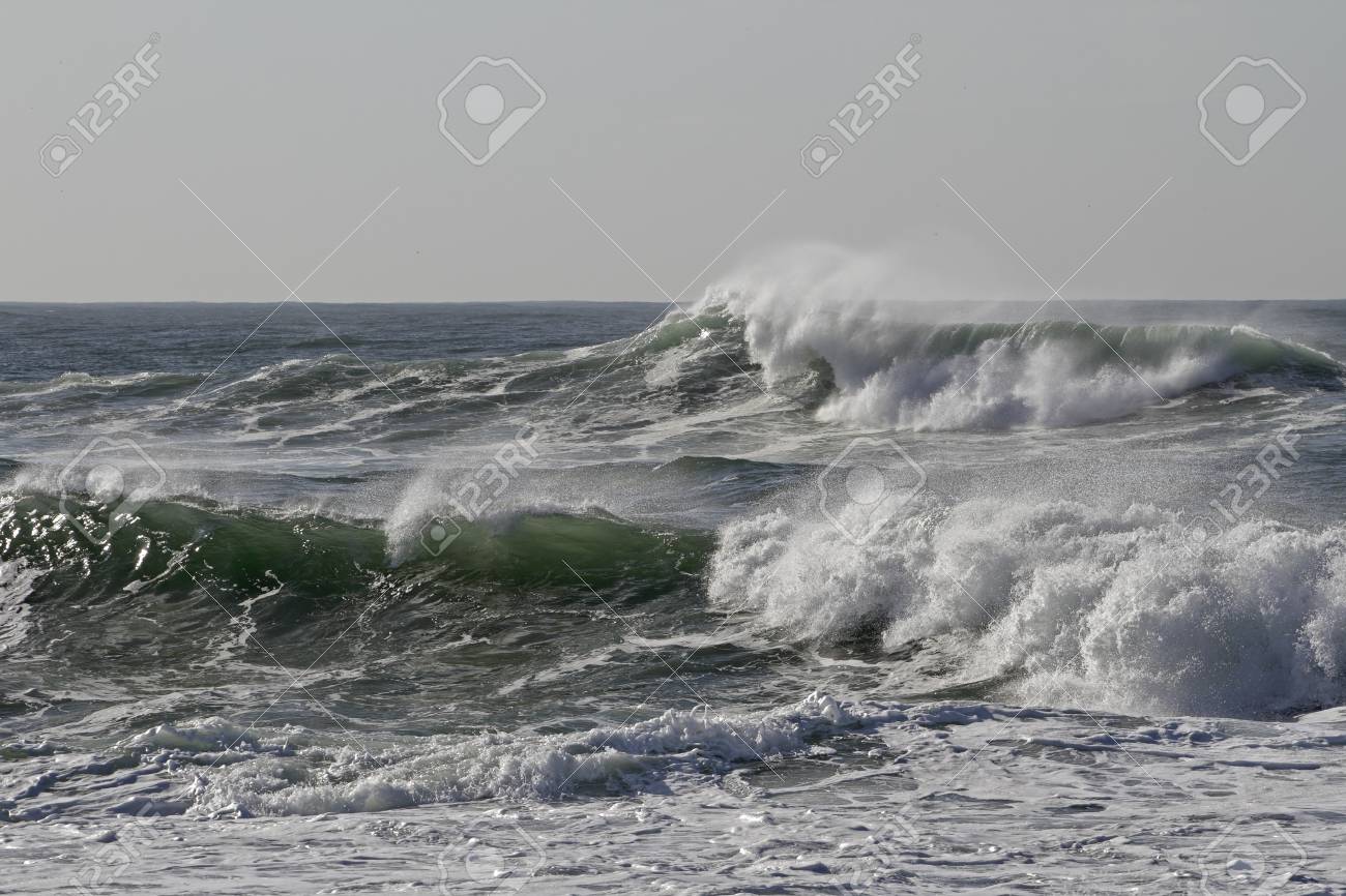 Sunny sea wave with wind spray. Northern portuguese coast. - 119924764 Sunny sea wave with wind spray. Northern portuguese coast. - 119924764