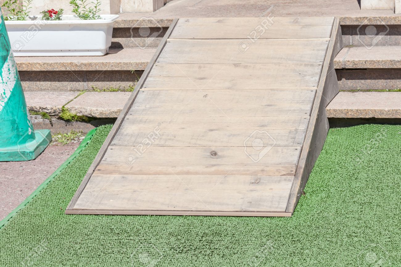 wooden ramped access using wheelchair ramp for disabled people