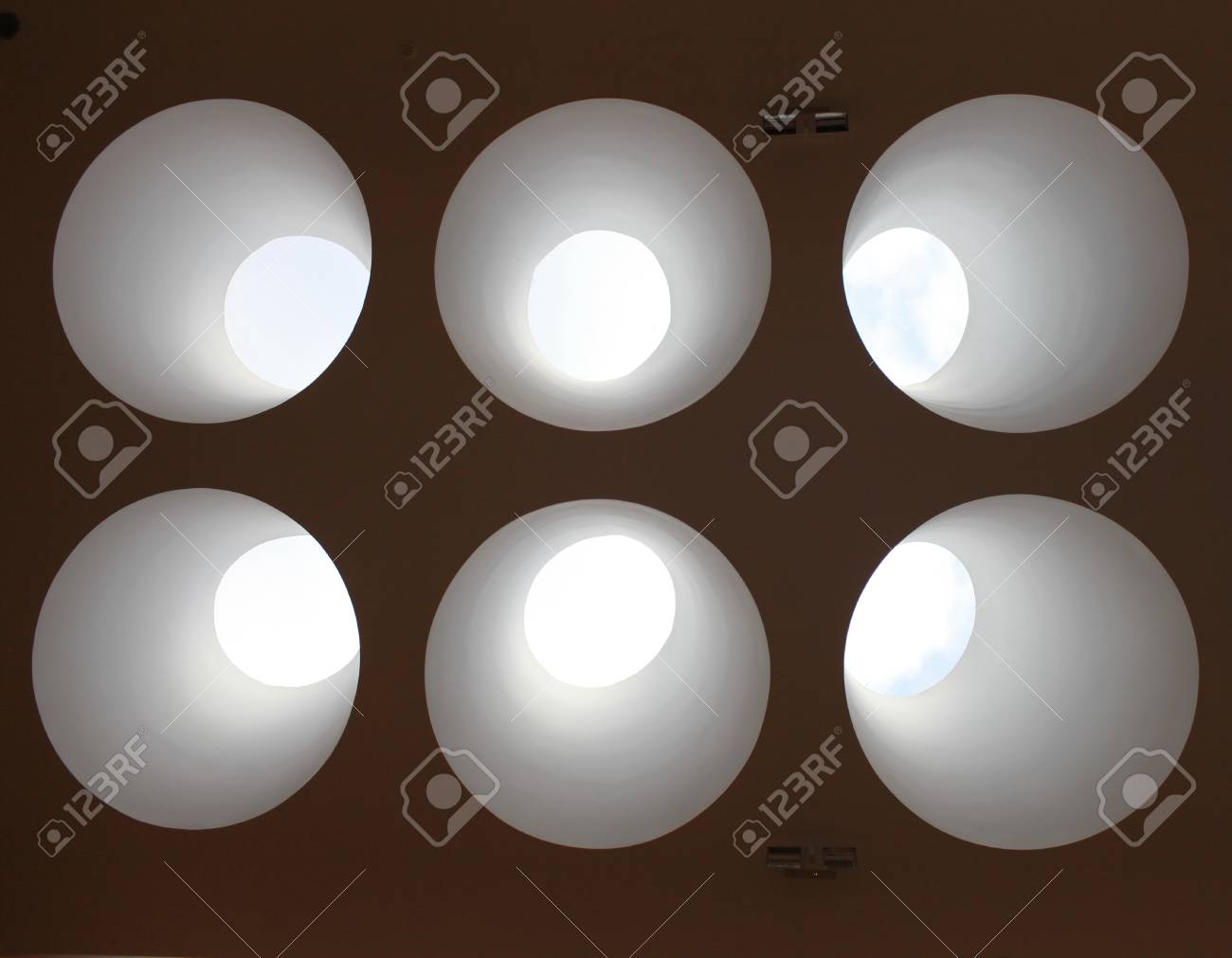 Sky Light Going Through The Round Hole In A Ceiling Stock Photo