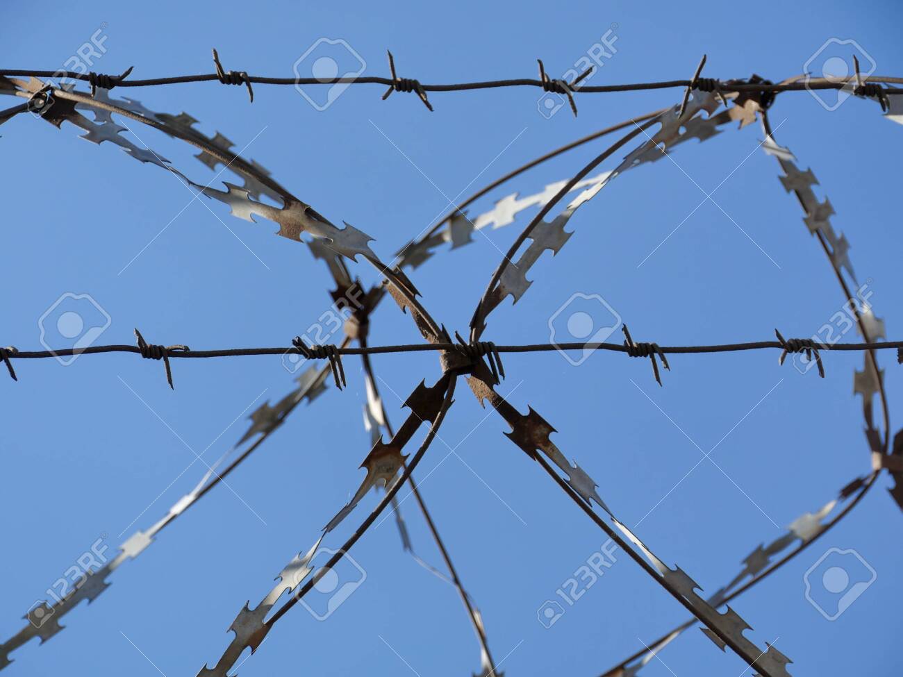 Razor Wire In The Blue Sky Close To Stock Photo Picture And Royalty Free Image Image 121081233