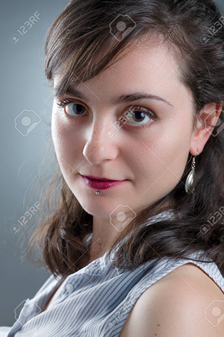 pretty girl with red lipstick and labret piercing stock photo