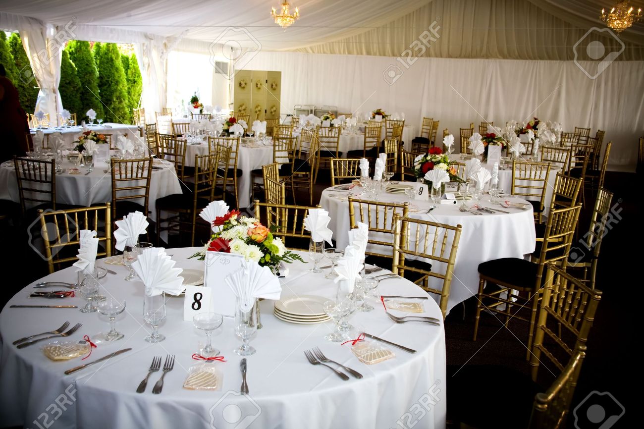 Decorated Tables table set for a wedding or catered social event, decorated cookie Decorated Tables table set for a wedding or catered social event, decorated cookie