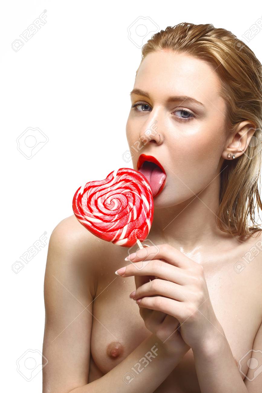 Young Sexy Nude Blonde Posing Topless For Beauty With Red Sweet Candy Stock  Photo, Picture and Royalty Free Image. Image 56560537.
