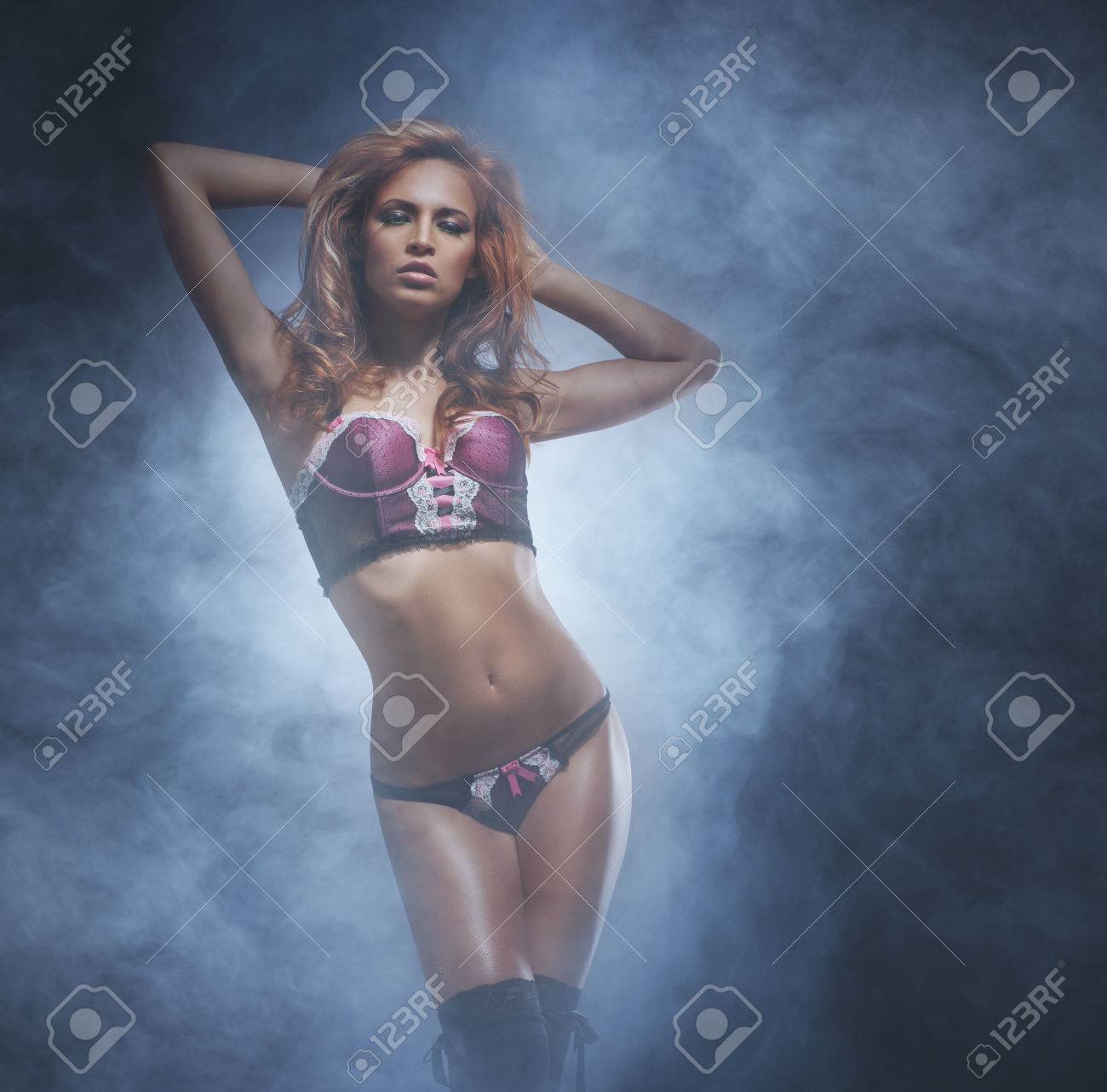 Beautiful And Sexy Striptease Dancer Over The Smoky Background Stock Photo,  Picture and Royalty Free Image. Image 38681537.