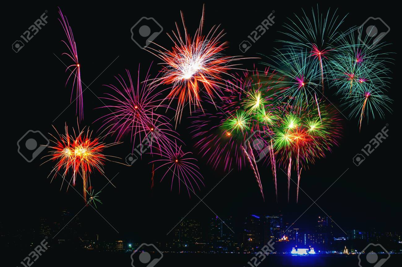 Beautiful colorful fireworks display on the sea beach, Amazing holiday fireworks party or any celebration event in the dark sky. - 126021039 Beautiful colorful fireworks display on the sea beach, Amazing holiday fireworks party or any celebration event in the dark sky. - 126021039