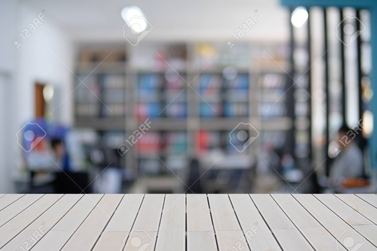 mock up empty wooden table on front blurred office background blurred office background