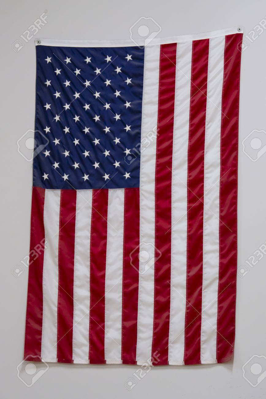 Hanging Flag On Wall a big american flag in a gymnasium at a school hanging on a wall Hanging Flag On Wall a big american flag in a gymnasium at a school hanging on a wall