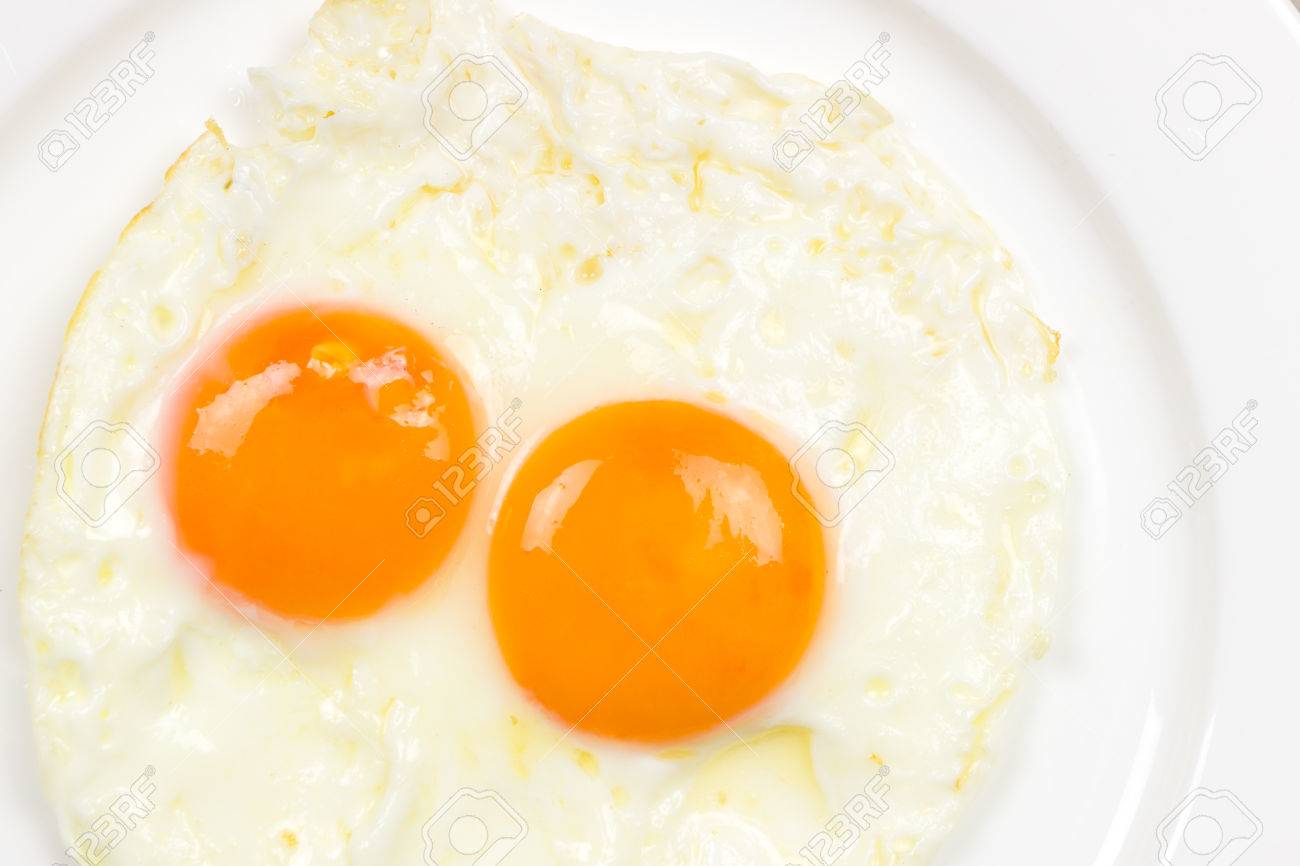 2 Fried Egg On White Plate Close Up Stock Photo, Picture and Royalty Free  Image. Image 28794595.