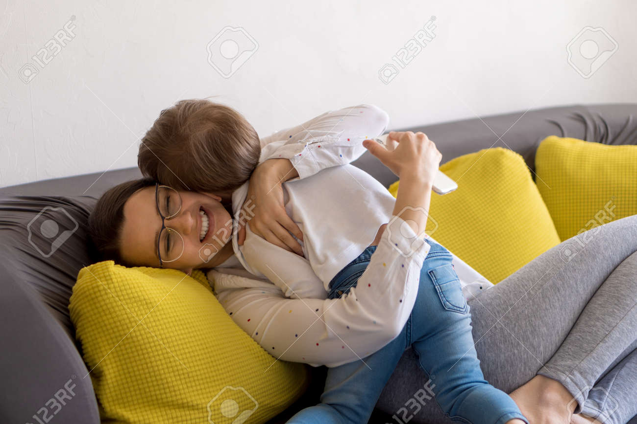 caucasian family little preschool baby boy and mom talking video conference by smartphone together in living room at home with happiness smile. activity technology lifestyle mobile phone use concept - 166761679 caucasian family little preschool baby boy and mom talking video conference by smartphone together in living room at home with happiness smile. activity technology lifestyle mobile phone use concept - 166761679