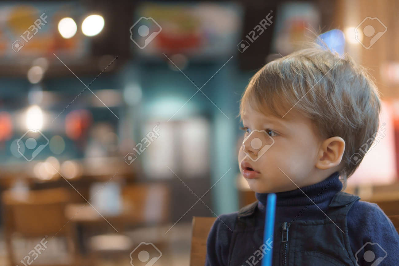 authentic portrait little handsome blond sad boy sitting in cafe in evening alone. Preschool toddler kid child eating and drinking fast food lunch in restaurant. Family, childhood, health, rest - 167093102 authentic portrait little handsome blond sad boy sitting in cafe in evening alone. Preschool toddler kid child eating and drinking fast food lunch in restaurant. Family, childhood, health, rest - 167093102