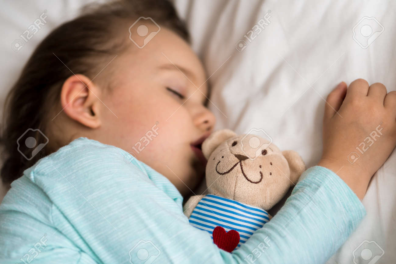 Authentic portrait sick cute caucasian little preschool baby boy in blue sleep with teddy bear on white bed. child resting at lunchtime. care, medicine and health, Childhood, Parenthood, life concept - 167122618 Authentic portrait sick cute caucasian little preschool baby boy in blue sleep with teddy bear on white bed. child resting at lunchtime. care, medicine and health, Childhood, Parenthood, life concept - 167122618