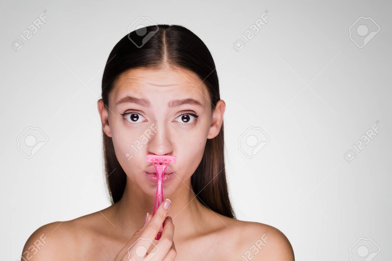 shaving mustache with razor female