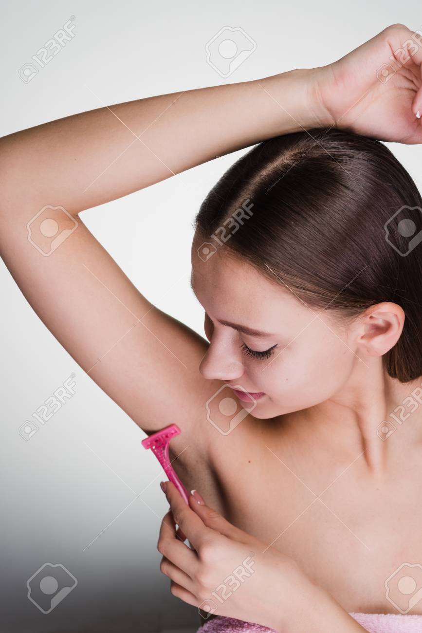 Young girl with armpit hair Young Attractive Girl After Shower Shaves Her Hair On Her Armpits With A  Pink Razor Stock Photo, Picture and Royalty Free Image. Image 93547414.