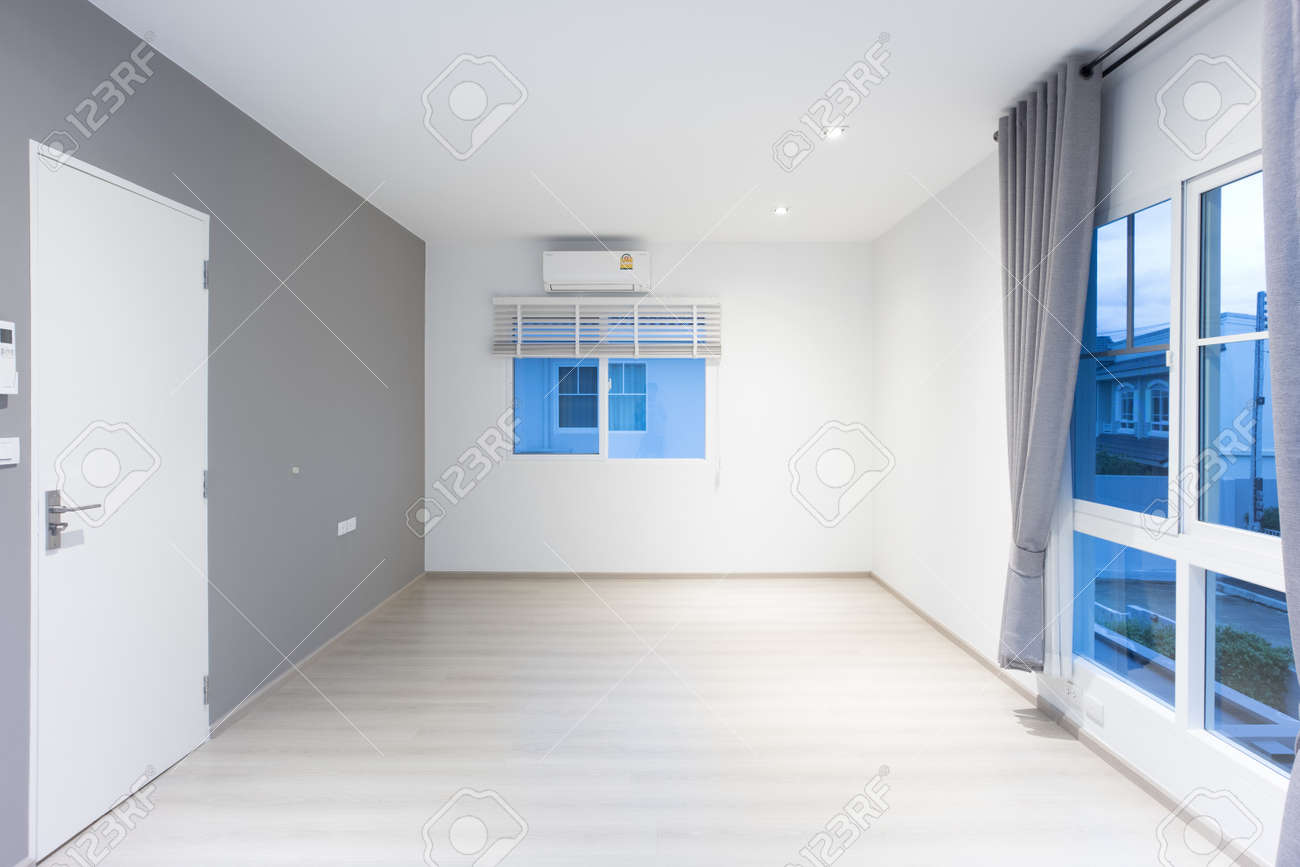 Empty Room Or Bedroom At Night. Interior Inside House Consist Of Wooden  Laminate Floor, White Gray Wall, Air Conditioner, Curtain And Adjusting  Vertical Blinds. New Clean Look Modern For Background. Stock Photo,, image size:1300x867