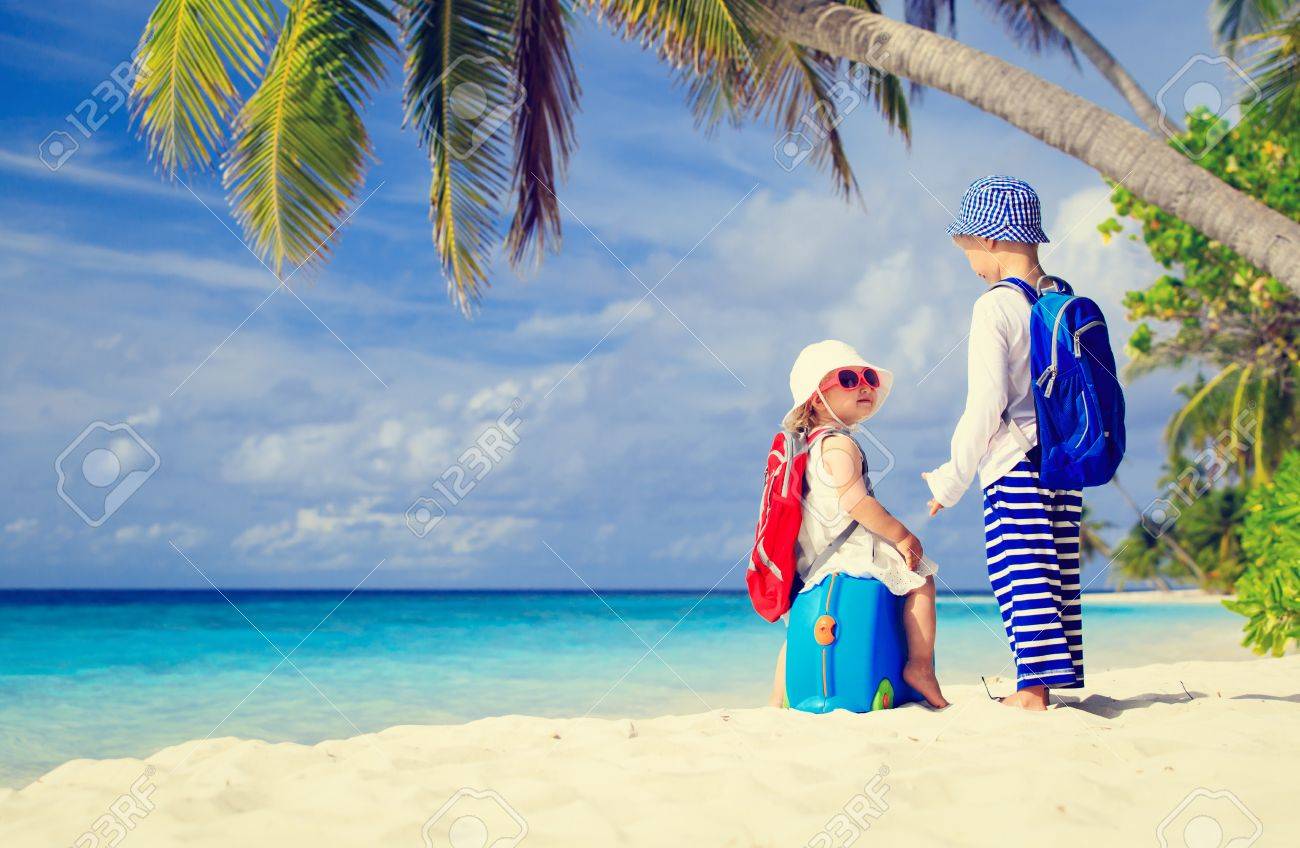 little boy and girl travel on summer tropical beach family vacation