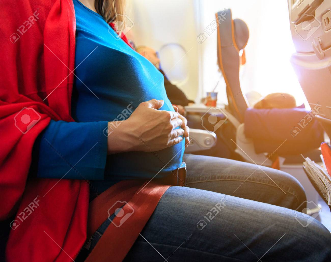 pregnant woman travel by plane, family travel - 59940727 pregnant woman travel by plane, family travel - 59940727