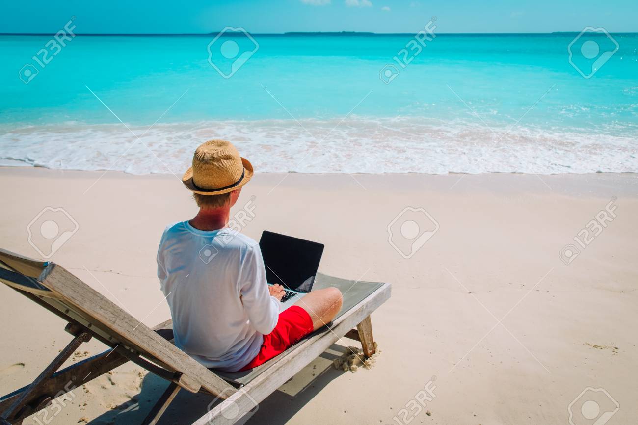 100039965-young-man-working-on-laptop-at