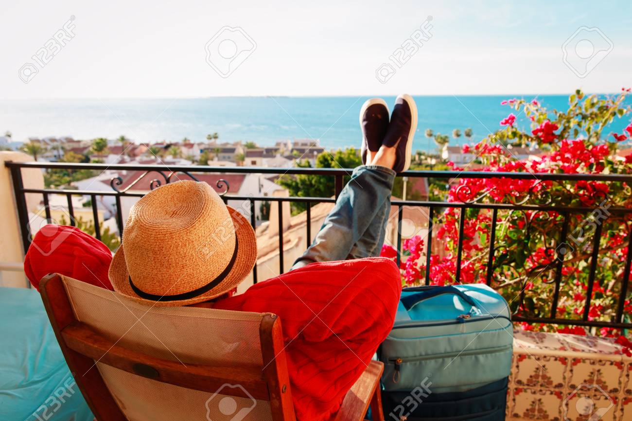 young man tourist relax on scenic balcony terrace - 101280072 young man tourist relax on scenic balcony terrace - 101280072