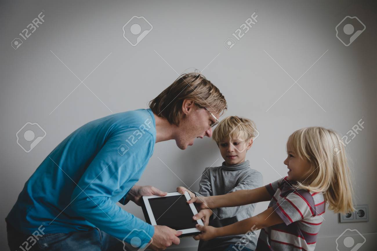 computer addiction father taking touch pad from angry kids computer addiction