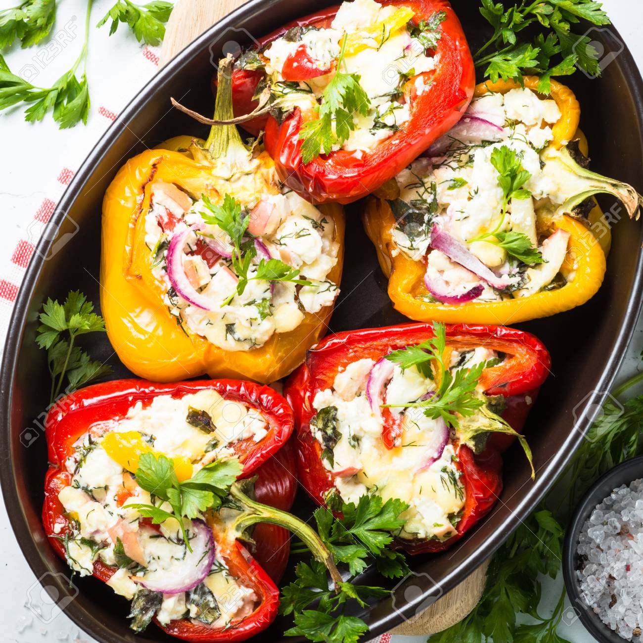 Download Red And Yellow Bell Stuffed Paprika Peppers With Cheese And Herbs Stock Photo Picture And Royalty Free Image Image 85213988 Yellowimages Mockups