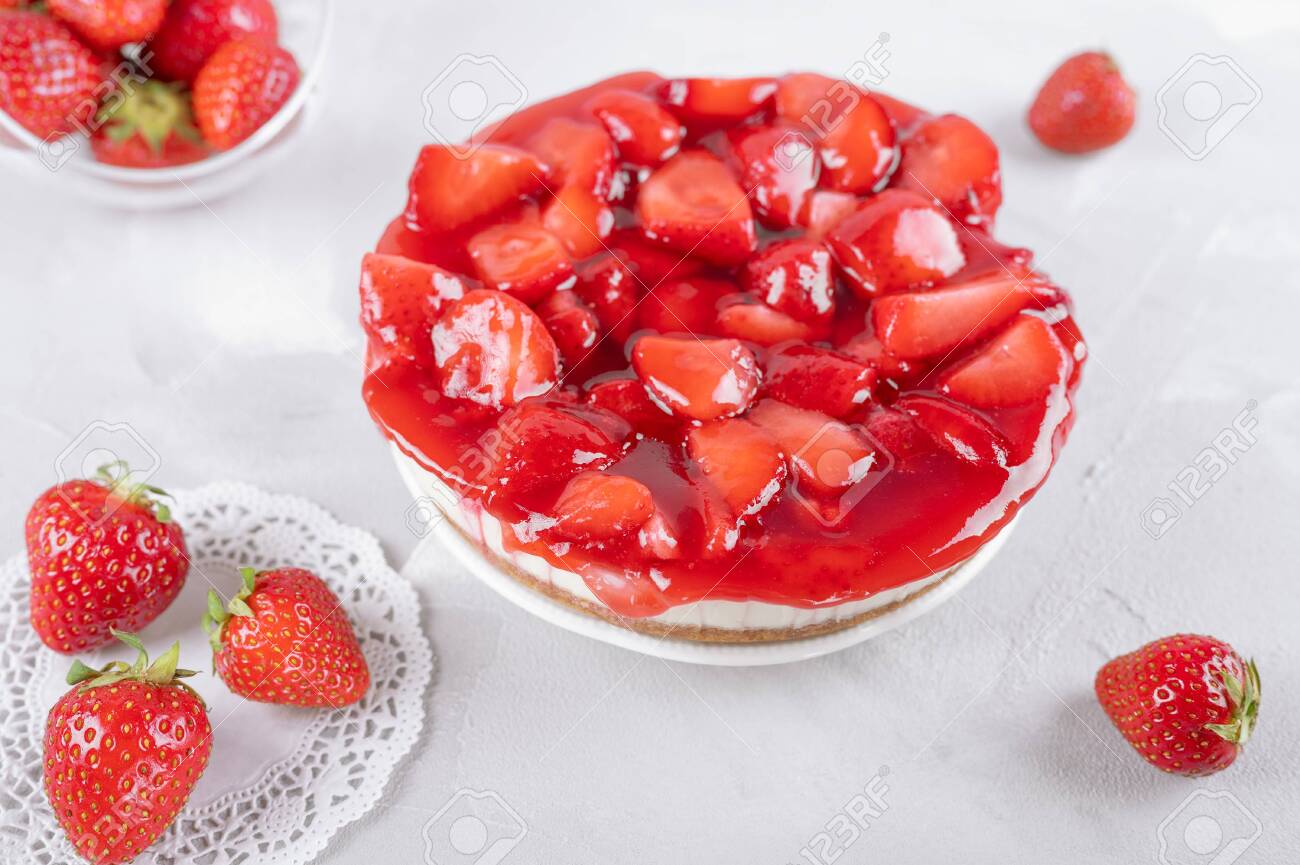 cheesecake with strawberry and fresh berries on gray table, closeup - 148019199 cheesecake with strawberry and fresh berries on gray table, closeup - 148019199