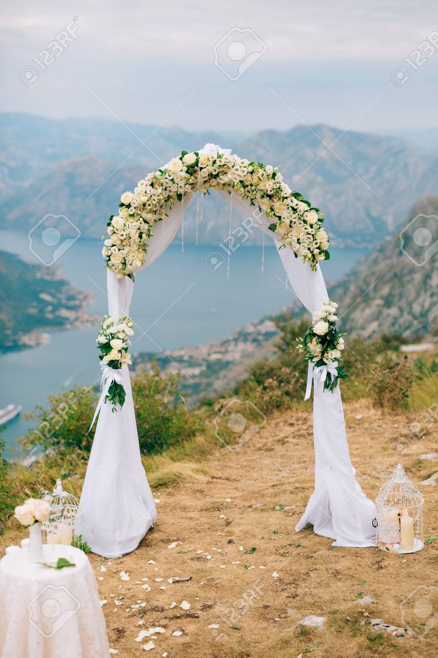 https://previews.123rf.com/images/nadtochiy/nadtochiy1704/nadtochiy170401042/85625001-a-wedding-in-the-mountains-wedding-arch-for-the-ceremony-on-the-summit-of-mount-lovcen-in-montenegro.jpg