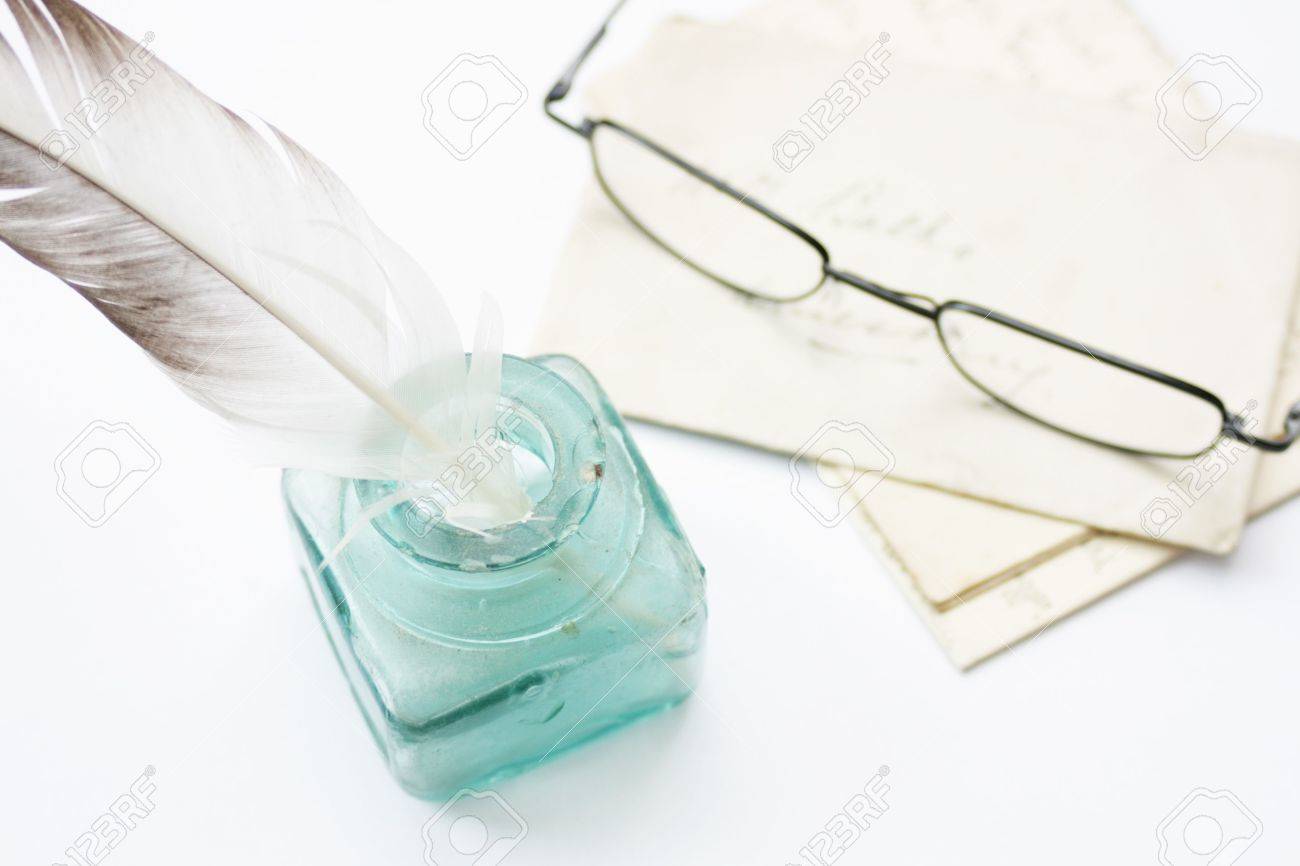 a feathered quill pen