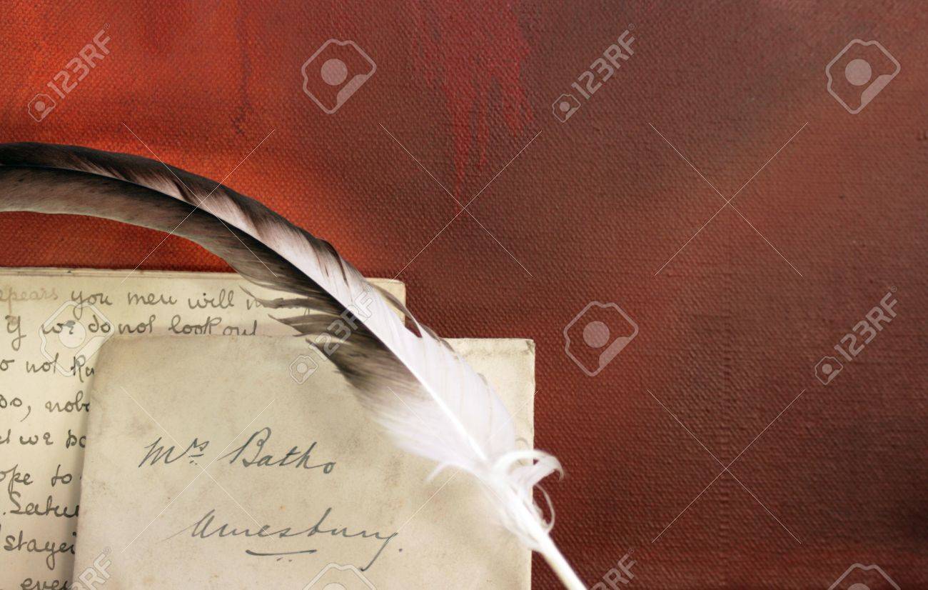 period set up of a letter quill pen set on top of a wooden mantle