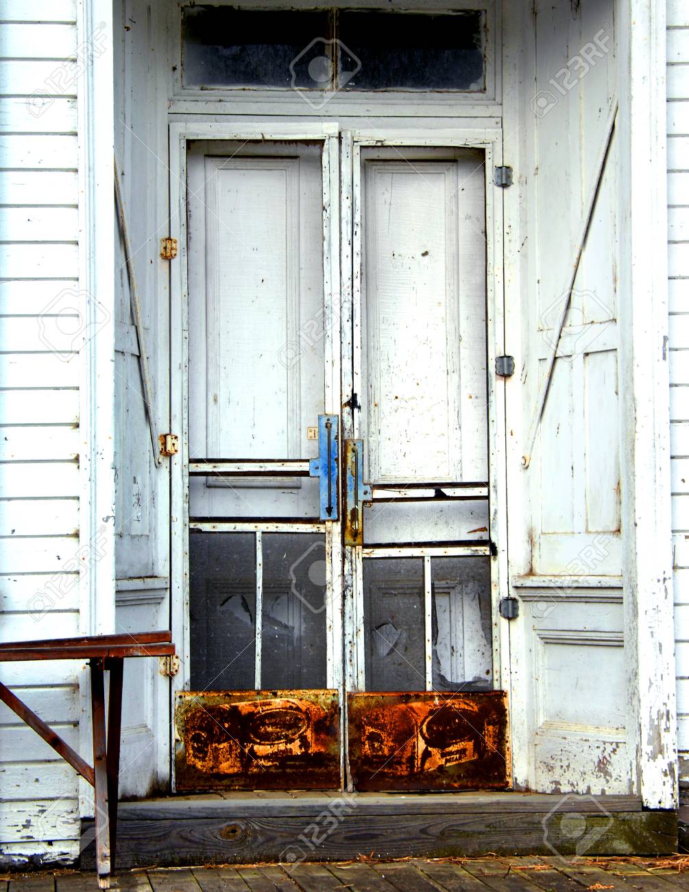 Old Wooden Country Store Has Double Doors With Screen Protectors